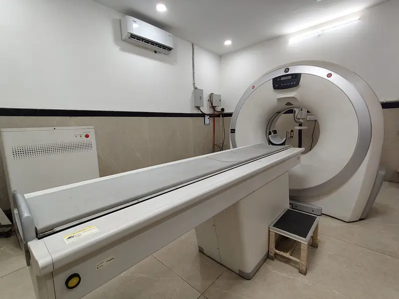 CT scanner and patient table in the CT room at Om Imaging Centre